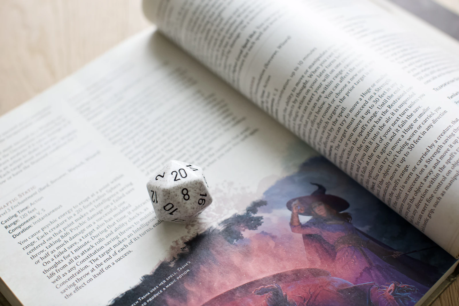 Dice sitting on top of the 2024 5e spell list